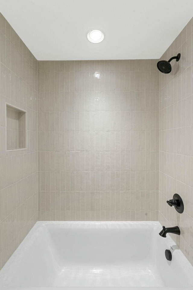 bathroom with recessed lighting and  shower combination