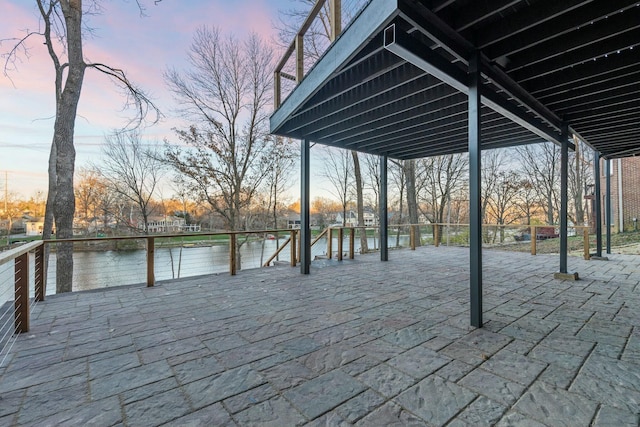 exterior space with a patio area and a water view