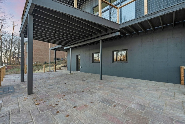 view of patio terrace at dusk