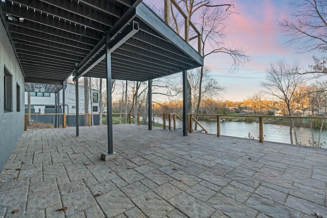 view of patio featuring a water view