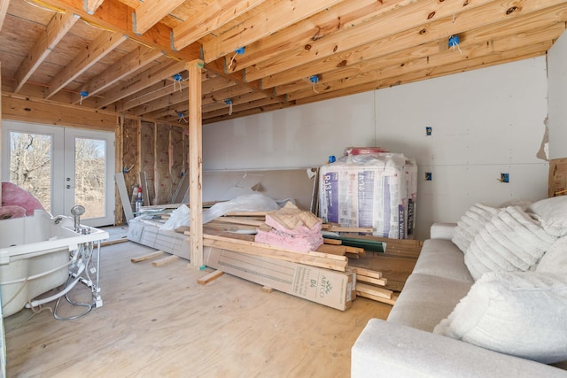 bedroom featuring access to outside and french doors