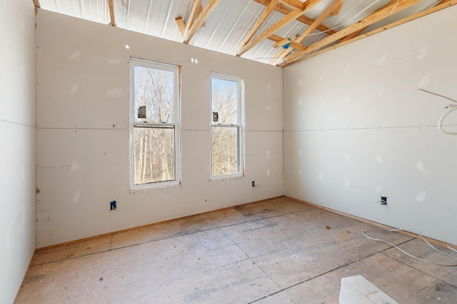 unfurnished room featuring plenty of natural light