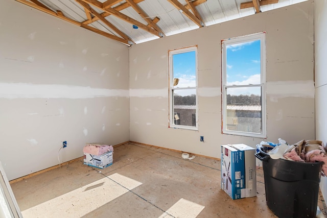 empty room with lofted ceiling