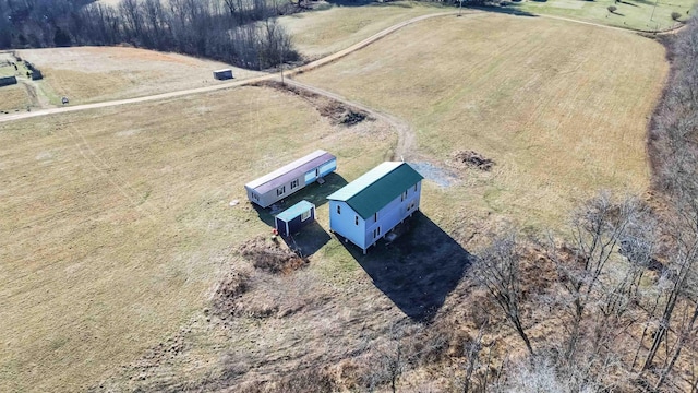 birds eye view of property featuring a rural view