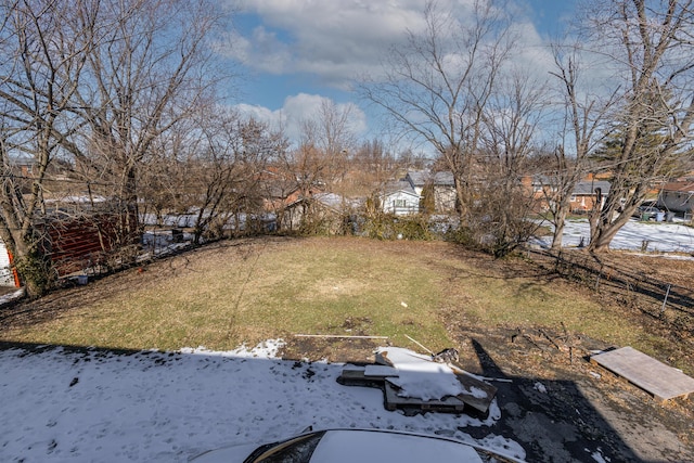 view of yard layered in snow