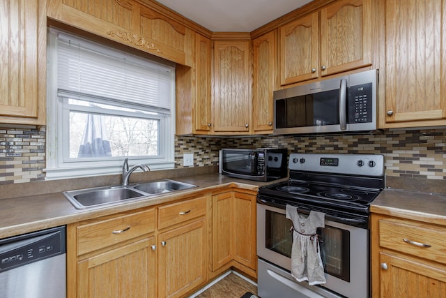 kitchen with sink, backsplash, and stainless steel appliances