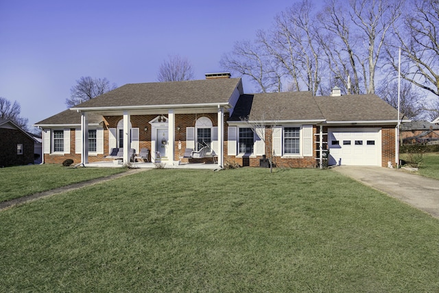 view of front of property featuring a garage and a front lawn