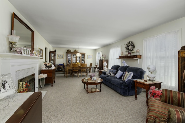 living room featuring a premium fireplace