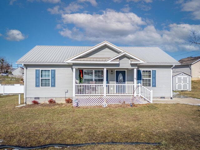 view of front of home featuring covered porch and a front lawn