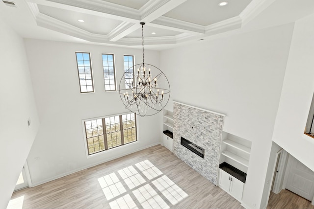 417 Weston Park, Lexington, KY 40515 - unfurnished living room featuring light wood finished floors, a stone fireplace, recessed lighting, crown molding, and a chandelier