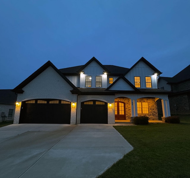 417 Weston Park, Lexington, KY 40515 - view of front of home featuring driveway, a front lawn, board and batten siding, and brick siding