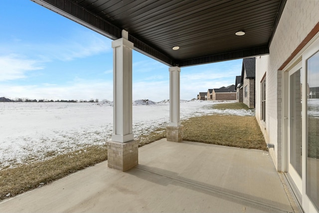 view of snow covered patio