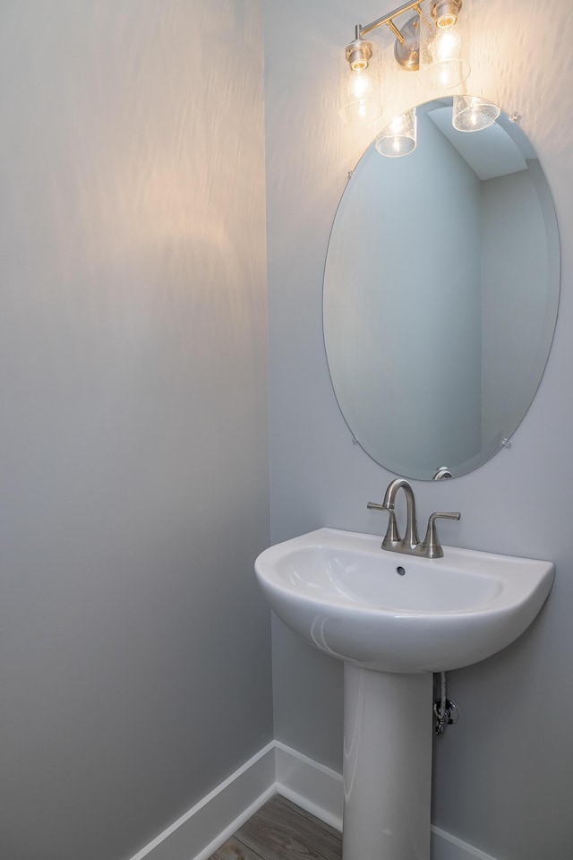 bathroom featuring sink and hardwood / wood-style flooring