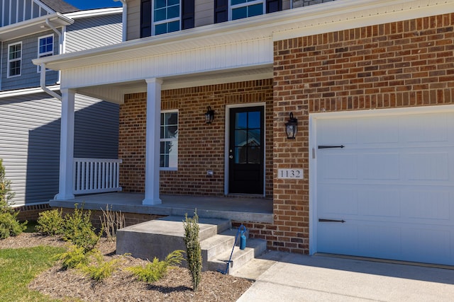 entrance to property featuring a porch