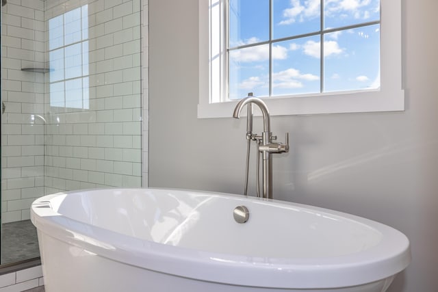 bathroom with sink and independent shower and bath