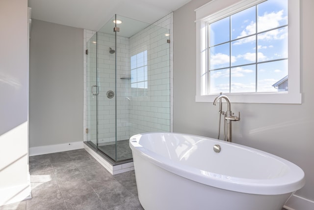 bathroom featuring independent shower and bath