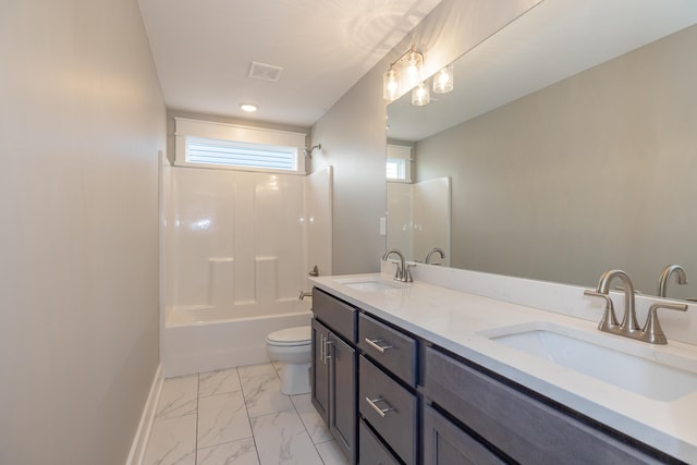 full bathroom featuring bathing tub / shower combination, vanity, and toilet