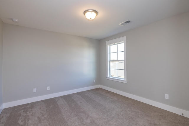 spare room with carpet floors