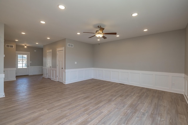 unfurnished room with light hardwood / wood-style flooring and ceiling fan