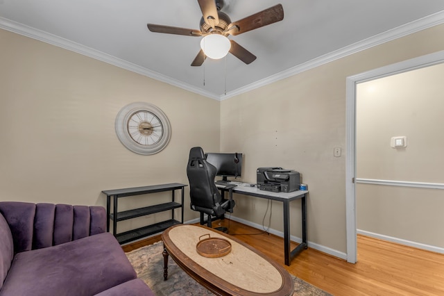 home office with hardwood / wood-style flooring, ceiling fan, and ornamental molding