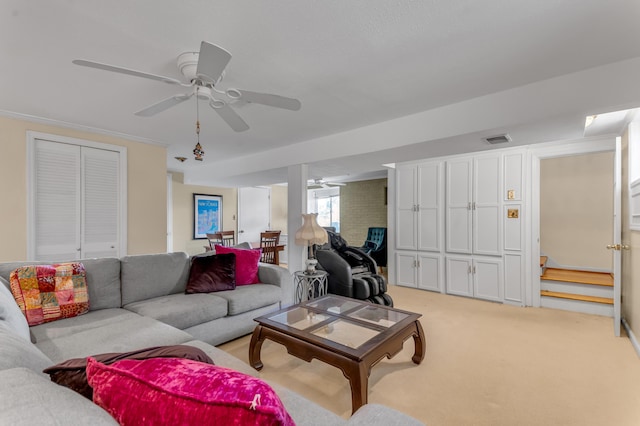 living room featuring light colored carpet and ceiling fan