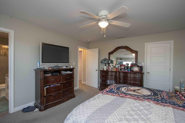 carpeted bedroom featuring ceiling fan and ensuite bath