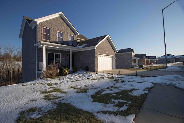 view of front facade with a garage and a porch