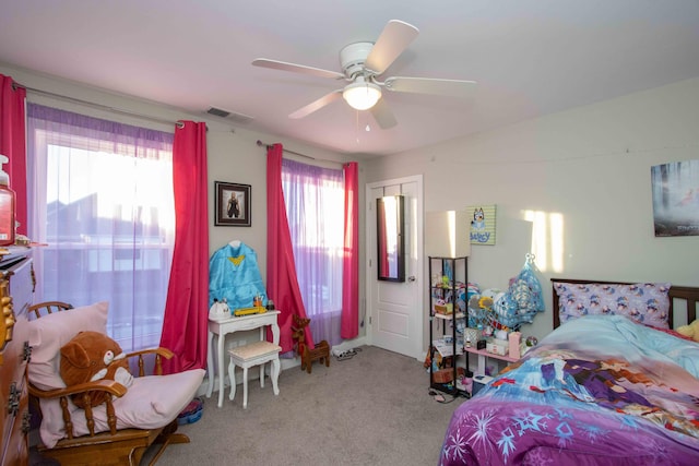 bedroom featuring light colored carpet and ceiling fan