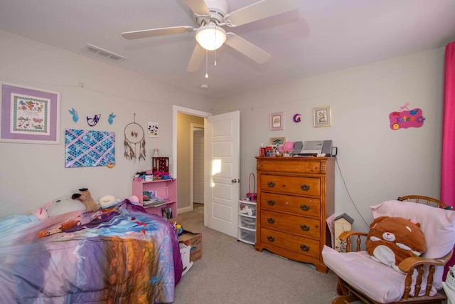 bedroom with ceiling fan and light carpet