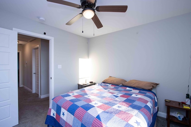 bedroom featuring dark carpet and ceiling fan