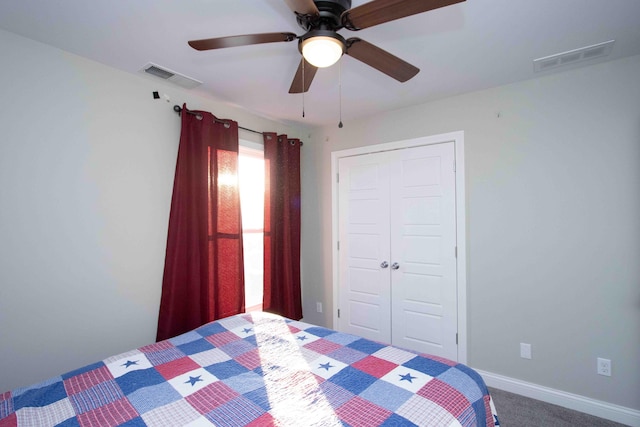 unfurnished bedroom featuring carpet floors, ceiling fan, and a closet