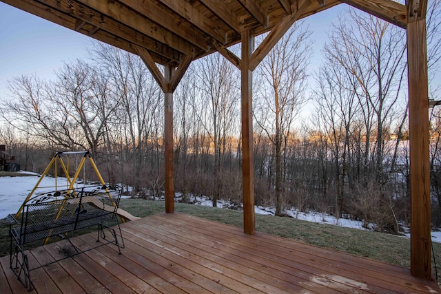 deck at dusk with a playground