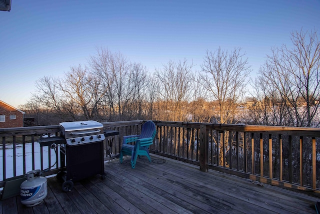 deck at dusk with grilling area