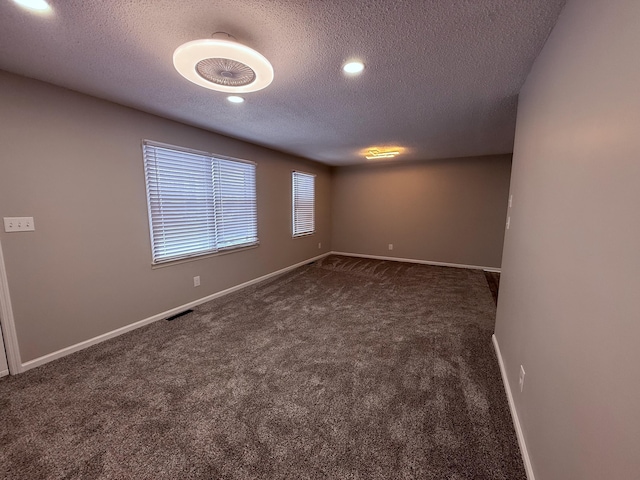 106 Liberty Ave, Berea, KY 40403 - carpeted spare room with a textured ceiling, baseboards, and visible vents