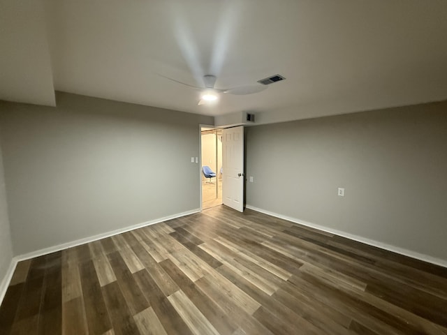 106 Liberty Ave, Berea, KY 40403 - spare room with baseboards, visible vents, a ceiling fan, and dark wood-style flooring