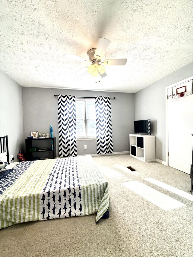 428 Columbia Ave, Monticello, KY 42633 - carpeted bedroom with a textured ceiling and ceiling fan