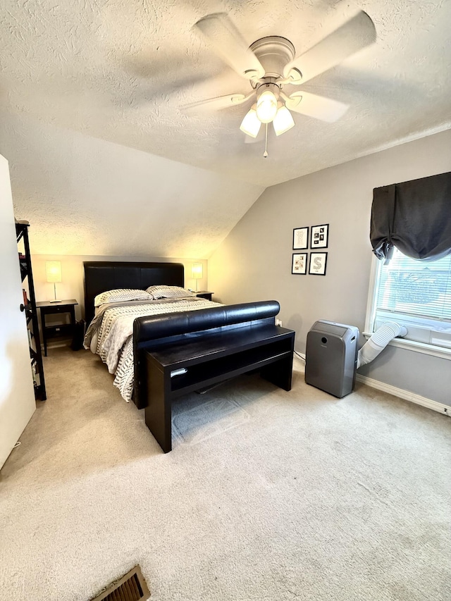 428 Columbia Ave, Monticello, KY 42633 - bedroom featuring a textured ceiling, ceiling fan, vaulted ceiling, and light carpet