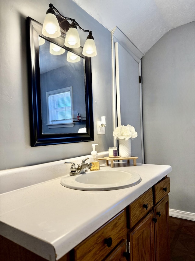 428 Columbia Ave, Monticello, KY 42633 - bathroom with lofted ceiling, vanity, and baseboards