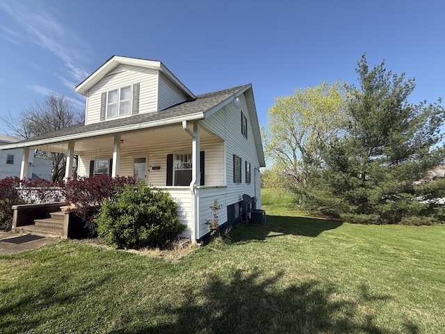 428 Columbia Ave, Monticello, KY 42633 - view of side of property featuring central AC unit, a yard, a porch, and a shingled roof