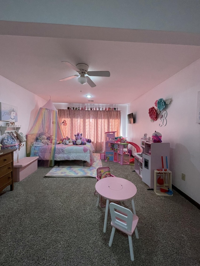 bedroom with ceiling fan and carpet