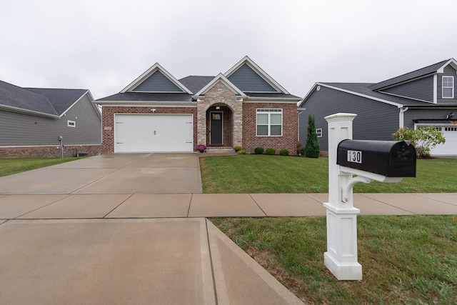 view of front of property with an attached garage, a front yard, concrete driveway, and brick siding