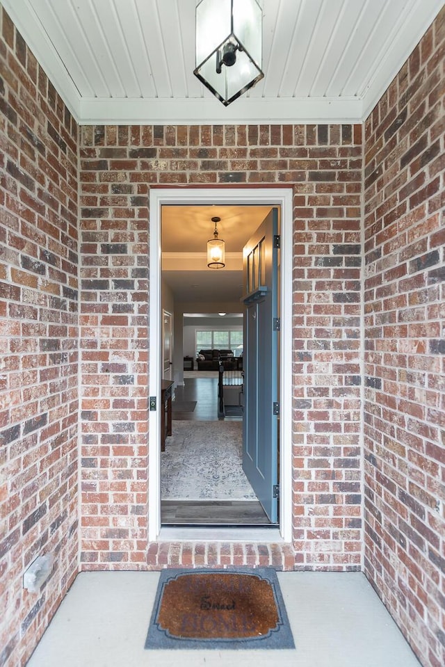 property entrance with brick siding