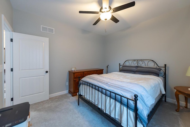 carpeted bedroom featuring visible vents, ceiling fan, and baseboards