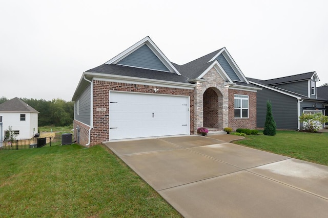 view of front of house with driveway, a front yard, fence, and brick siding