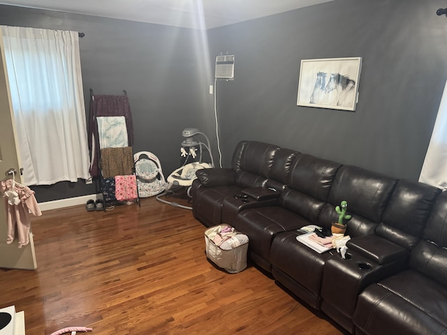 living room with hardwood / wood-style flooring and a wall mounted AC