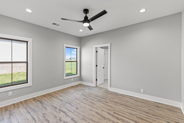 unfurnished room with light hardwood / wood-style floors and ceiling fan