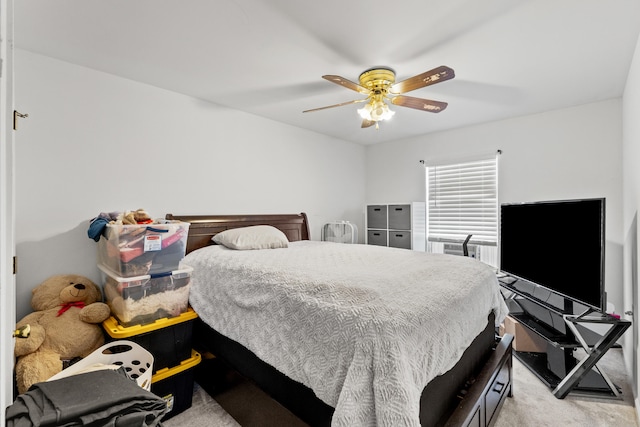 bedroom featuring light carpet and ceiling fan