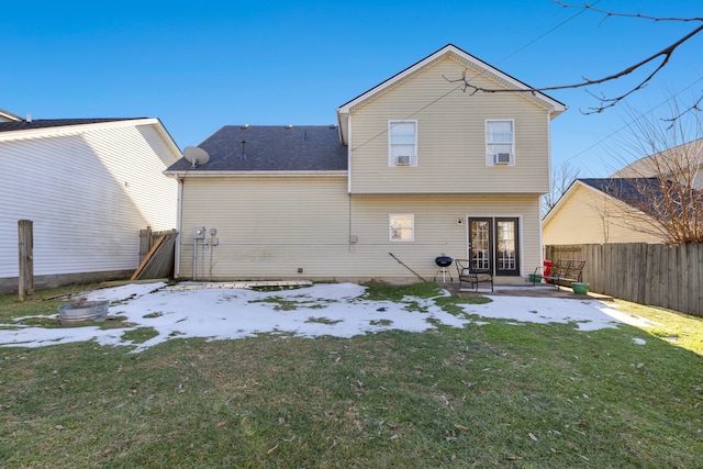 rear view of property with a yard and a patio