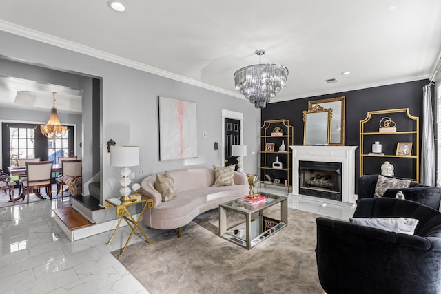 living room featuring ornamental molding, a notable chandelier, and a high end fireplace