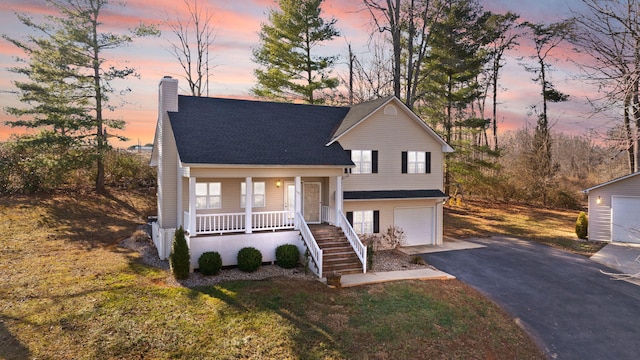 view of front of house with a garage and covered porch